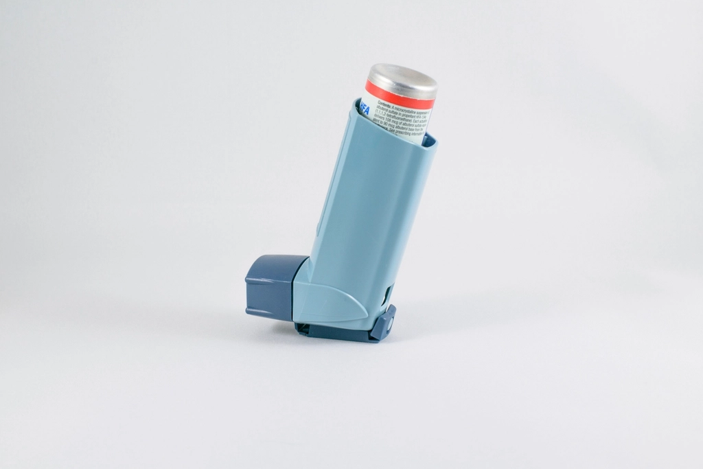 Asthma inhaler, representing online asthma review and prescription