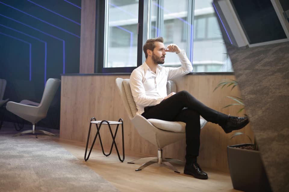 Man sitting thoughtfully, representing confidential erectile dysfunction consultations